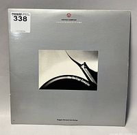 Front of the vinyl record album sleeve showing the Vertigo Sampler title and photo of curved vinyl record.