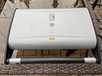 Closed Lean Mean Fat Grilling Machine showing handle and compact design from a slight angle.