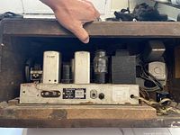 Back side of the radio showing the internal tube assembly, transformers, and power connections.