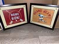 Pair of framed baseball-themed decorative art prints featuring 'HOME RUN' and 'GRAND SLAM'