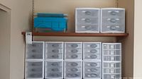 Wide shot of two shelves filled with plastic storage units