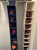 Two fabric hanging shoe holders in navy blue and beige colors filled with shoes, showing multiple compartments with various pairs of shoes inside.