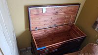 Open Lane cedar chest showing cedar wood interior and brass hardware.