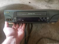 Front view of Sanyo VCR player showing VHS compartment and front RCA jacks