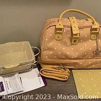 Thermal tote set including polka dot satchel, 2-quart baker with wire holder, tempered glass trivet, and plastic cover, with paperwork.