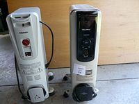 Front and side view of two oil-filled heaters showing Noma and Pelonis branding