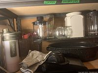 Image showing kitchen glassware, thermos, oven mitts and granite-style pork roasting pans