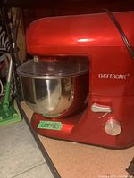 Side view of the red Cheftronic kitchen mixer with stainless steel bowl and control dial.
