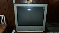 Front view of Sanyo 27-inch CRT TV showing screen and speaker grills below the screen.