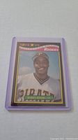 Barry Bonds rookie baseball card featuring him in Pittsburgh Pirates uniform with Toys R Us Collector's Rookies branding in protective sleeve.