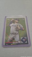 Photo of a Bo Bichette rookie baseball card in a plastic protective sleeve.