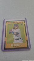 Front of Bo Bichette rookie baseball card in purple sleeve showing player image and Novas 90 Performers branding.