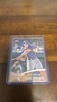 Front view of George Springer rookie card showing player in batting stance with team logo and name.