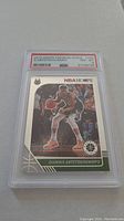 Photo of one 2019 NBA Hoops Premium Stock Giannis Antetokounmpo basketball card graded PSA 8 in protective case.