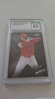 Photo of a 2021 Topps Chrome Black baseball card featuring Shohei Ohtani in a batting stance. The card is graded 8.5 by Certified Sports Guaranty and encased in a clear protective holder.