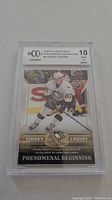 Front view of Sidney Crosby rookie card graded BCCG 10 in protective slab.