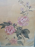 Close-up photo showing detailed view of pink peonies, leaves, and signature dated 1943 by Doris Hale Heinz.