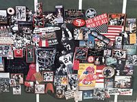 Close-up photo showing a collage of San Francisco 49ers memorabilia print including images, tickets, logos, and other souvenir representations.