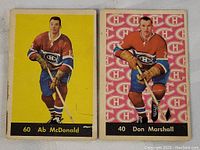 Two vintage hockey cards from 1960-62 Parkhurst series showing Montreal Canadiens players Ab McDonald (card #60) and Don Marshall (card #40). Cards exhibit some edge wear and creases.