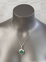 Front view of the necklace displayed on a gray bust showing overall chain length and pendant position.
