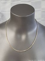 Full necklace displayed on a gray mannequin bust showcasing the full length and overall appearance.