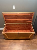 Open top view showing the chest's interior lined with cedar wood and the rubber sealed lid with Boshart logo.