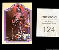 Single 1978 Donruss KISS trading card number 48 featuring a band member on stage in full makeup and costume with purple border.