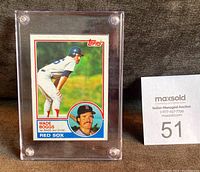 Front of the 1983 Wade Boggs Topps rookie card showing Wade Boggs in Red Sox uniform, encased in a plastic holder.