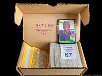Box containing the 1987 Leaf Baseball Card complete set of 264 cards with a displayed Barry Bonds card on top and the lot number '67'.