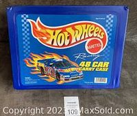 Blue 1997 Hot Wheels branded 48 car carry case closed, displaying logo and branding.