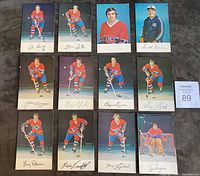 22 color photo postcards laid out in a grid, showing players including Ken Dryden, Guy Lafleur, Larry Robinson, Yvan Cournoyer, and others from the 1977/78 Montreal Canadiens hockey team in various poses with facsimile signatures.
