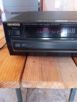 Front view showing Kenwood brand logo, model number DR-R4070 and multiple compact disc player carousel system.