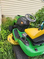 Side and front view of mower showing deck, chassis and wheel condition