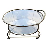 Full view of the serving cart showing the brass frame and two oval etched glass shelves.