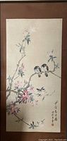 Front view of the framed and matted Chinese painting showing two birds on cherry blossom branches with calligraphy and artist seals.