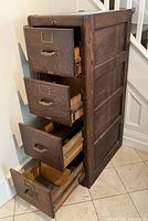 Cabinet angled view with all four drawers open to show interior construction