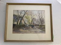 Full view of framed watercolor painting depicting village scene