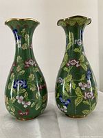 Front view of both vases side by side on white surface