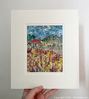 Image showing the monotype art print with white matting being held by a hand, highlighting the 10.5 x 9 inch mat and 6.5 x 4.5 inch art.