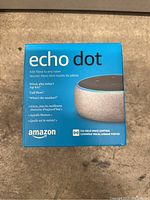 Front view of the Amazon Echo Dot box highlighting product name and image of the device.