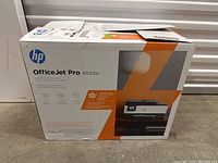 Box of HP OfficeJet Pro 8025e printer showing front with model name and some specifications.