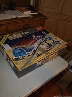 Front of original set box showing artwork of monorail, dome station, track and set number 6990