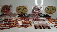 Overview of all Harley Davidson decals showing multiple designs and sizes laid out on a white surface.