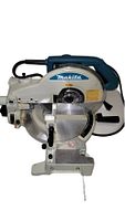Front view of Makita miter saw showing brand label, circular blade, and handle