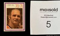 Close-up of 1970-71 Esso Power Play hockey sticker featuring player Bobby Hull, showing photo and sticker condition.