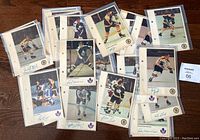 Lot of 30 NHL action player photos from 1970-71 season including 14 Toronto Maple Leafs and 16 Boston Bruins photos