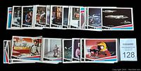 Layout of trading cards arranged in rows showing front images including characters and space ships from Space 1999 series.