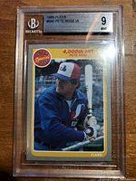 Front of 1985 Fleer baseball card #640 featuring Pete Rose, showing player image with Montreal Expos jacket and cap, holding bat. Card is inside Beckett protective case labeled Mint 9.