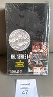 Front view of sealed 1991-92 Pro Set Platinum Series 1 NHL hockey card wax box with silver logo and collage of hockey player images.