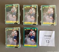 Five sealed hockey card sets with Eric Lindros featured on the card front, laid out flat from front view. Four of the packages show visible tape seals and consistent design.